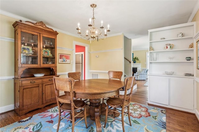 28 Shirley Rd, Newport News, VA 23601 - dining space with a chandelier, wood finished floors, and crown molding