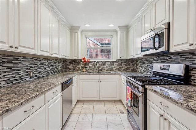 28 Shirley Rd, Newport News, VA 23601 - kitchen featuring stainless steel appliances, a sink, light marble finish flooring, white cabinetry, and recessed lighting