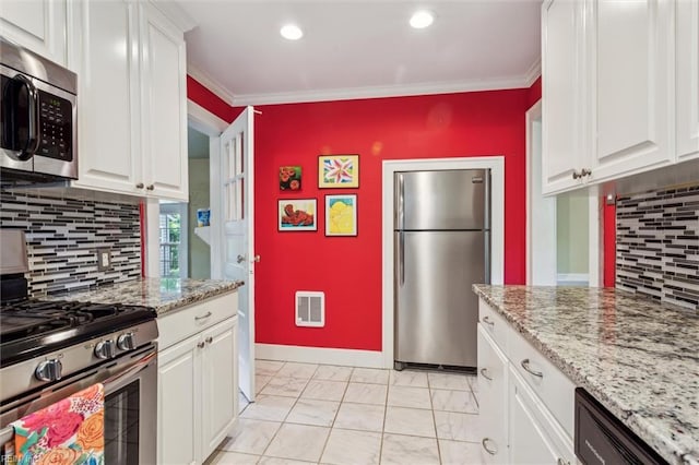 28 Shirley Rd, Newport News, VA 23601 - kitchen featuring appliances with stainless steel finishes, heating unit, white cabinets, light marble finish flooring, and recessed lighting