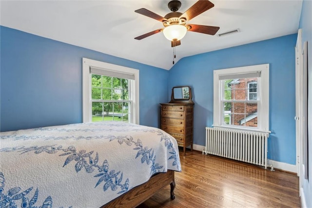 28 Shirley Rd, Newport News, VA 23601 - bedroom featuring radiator, wood finished floors, lofted ceiling, a ceiling fan, and baseboards