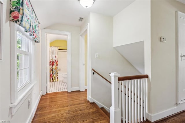 28 Shirley Rd, Newport News, VA 23601 - corridor with an upstairs landing, wood finished floors, vaulted ceiling, and baseboards