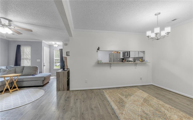 403 Joel Ct, Newport News, VA 23608 - dining space featuring a chandelier, a textured ceiling, wood finished floors, ceiling fan, and baseboards