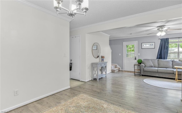 403 Joel Ct, Newport News, VA 23608 - living room featuring crown molding, wood finished floors, baseboards, stairway, and a chandelier
