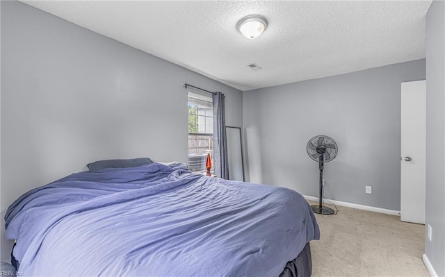 403 Joel Ct, Newport News, VA 23608 - bedroom with light colored carpet, a textured ceiling, and baseboards