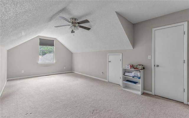 403 Joel Ct, Newport News, VA 23608 - bonus room with a textured ceiling, a ceiling fan, vaulted ceiling, carpet, and baseboards