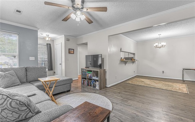 403 Joel Ct, Newport News, VA 23608 - living area with a textured ceiling, ceiling fan, a chandelier, wood finished floors, and ornamental molding