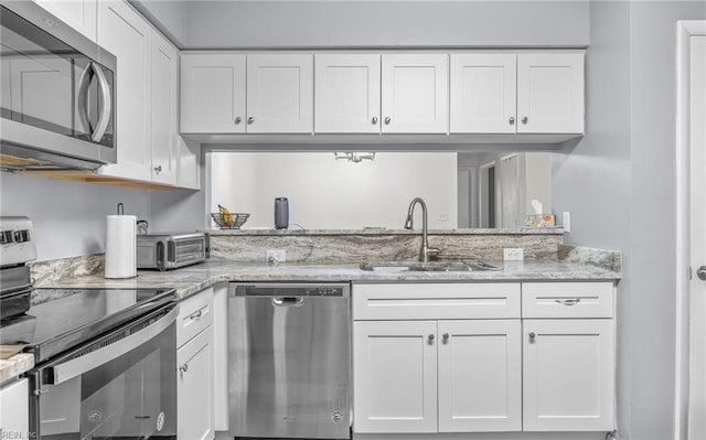 403 Joel Ct, Newport News, VA 23608 - kitchen with stainless steel appliances, a sink, and white cabinets