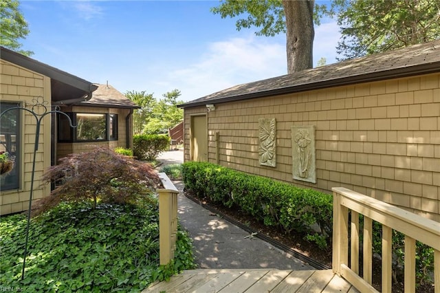 224 Iroquois Rd, Virginia Beach, VA 23462 - view of side of property with roof with shingles and a deck