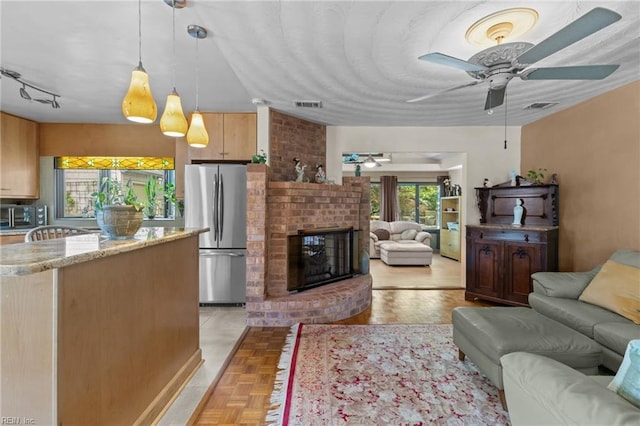224 Iroquois Rd, Virginia Beach, VA 23462 - living room featuring ceiling fan and a fireplace