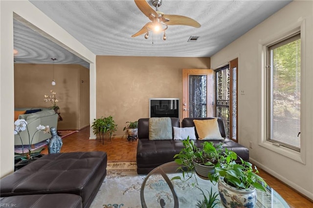 224 Iroquois Rd, Virginia Beach, VA 23462 - living room featuring ceiling fan and baseboards