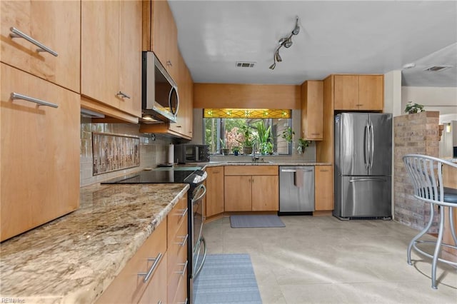 224 Iroquois Rd, Virginia Beach, VA 23462 - kitchen featuring stainless steel appliances, tasteful backsplash, light stone counters, and a sink