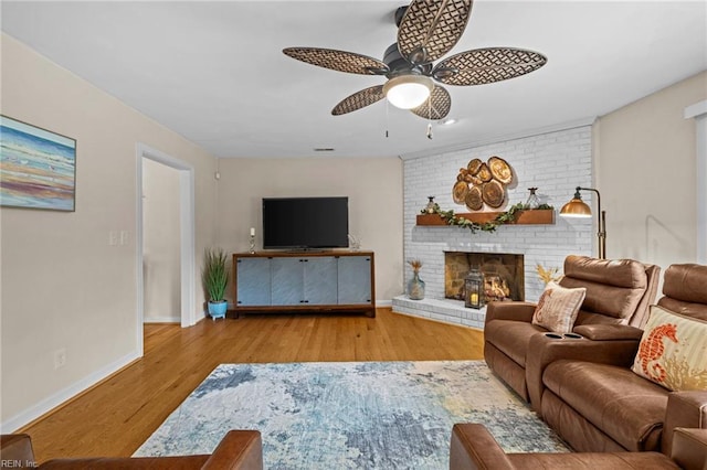4680 Miles Standish Rd, Virginia Beach, VA 23455 - living room featuring ceiling fan, wood finished floors, baseboards, and a brick fireplace