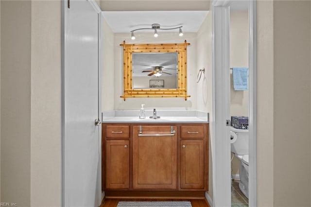 4680 Miles Standish Rd, Virginia Beach, VA 23455 - bathroom with toilet, vanity, and a ceiling fan
