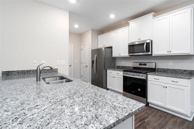 926 Pheasant Run, Williamsburg, VA 23188 - kitchen with appliances with stainless steel finishes, a sink, white cabinets, light stone countertops, and recessed lighting