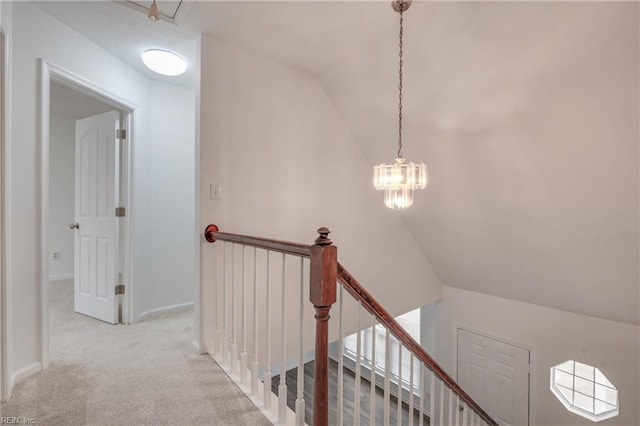926 Pheasant Run, Williamsburg, VA 23188 - hall featuring an upstairs landing, carpet flooring, lofted ceiling, and a chandelier