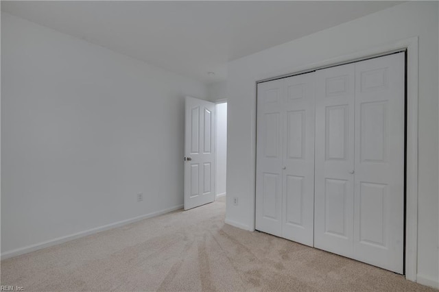 926 Pheasant Run, Williamsburg, VA 23188 - unfurnished bedroom featuring light carpet, baseboards, and a closet