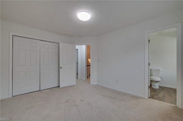 926 Pheasant Run, Williamsburg, VA 23188 - unfurnished bedroom with carpet flooring, a closet, baseboards, and ensuite bathroom