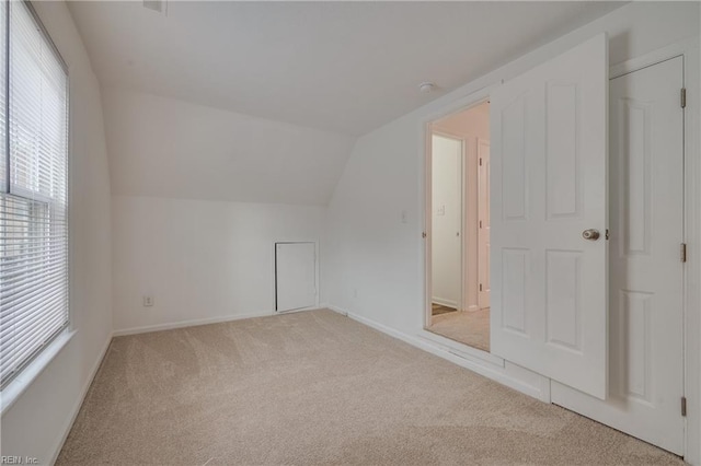 926 Pheasant Run, Williamsburg, VA 23188 - additional living space featuring light carpet, vaulted ceiling, and baseboards