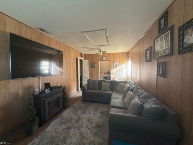 3904 Starboard Rd, Chesapeake, VA 23321 - living room with attic access, a ceiling fan, wood walls, and carpet floors