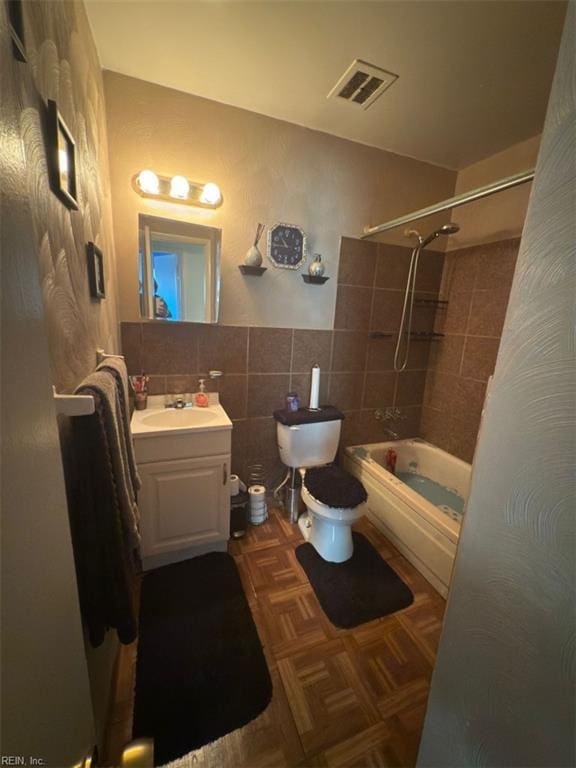 3904 Starboard Rd, Chesapeake, VA 23321 - bathroom featuring tile walls, toilet, vanity, and shower / tub combo with curtain