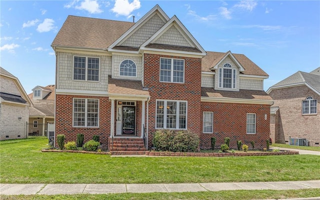 120 Niblick Cir, Suffolk, VA 23434 - view of front of house with a front yard, brick siding, and a shingled roof