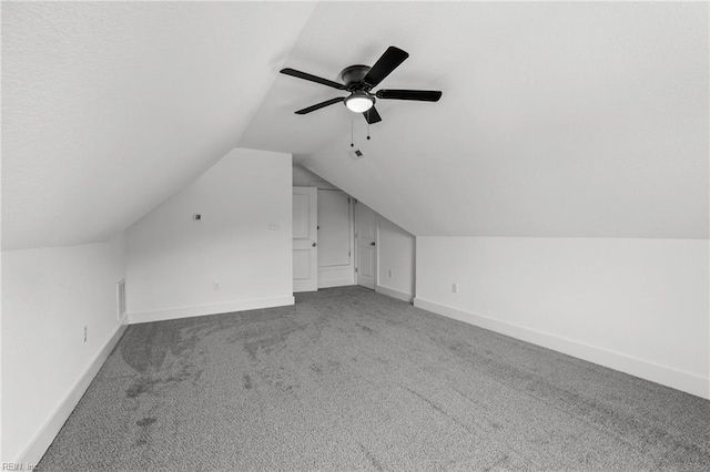 1064 Tulls Creek Rd, Moyock, NC 27958 - additional living space with carpet, lofted ceiling, baseboards, and a ceiling fan