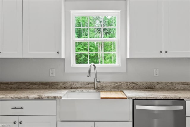 1064 Tulls Creek Rd, Moyock, NC 27958 - kitchen featuring dishwasher, a sink, white cabinets, and healthy amount of natural light