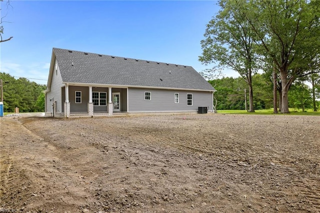 1064 Tulls Creek Rd, Moyock, NC 27958 - rear view of house featuring central AC unit and roof with shingles