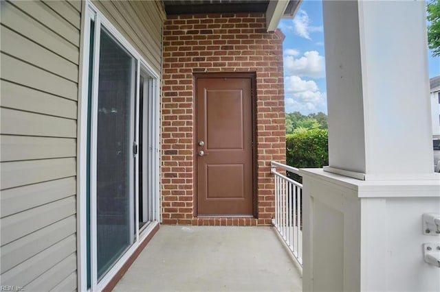 4316 Colindale Rd Unit 106, Chesapeake, VA 23321 - property entrance featuring brick siding and a balcony