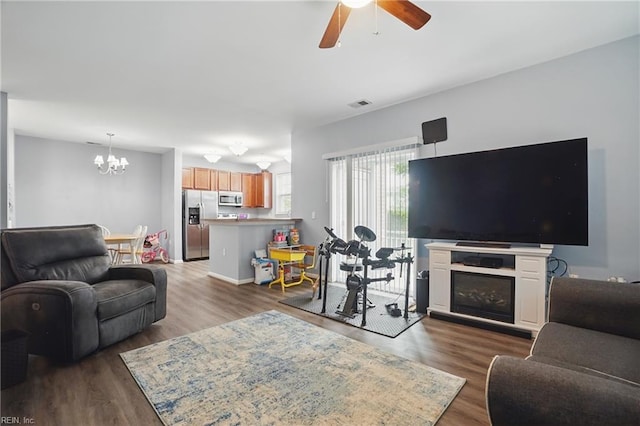 4316 Colindale Rd Unit 106, Chesapeake, VA 23321 - living area featuring a chandelier, ceiling fan, dark wood-style floors, and a glass covered fireplace