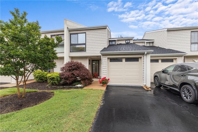 3934 Whispering Oaks Pl, Virginia Beach, VA 23455 - townhome / multi-family property with an attached garage, asphalt driveway, a front lawn, and a shingled roof