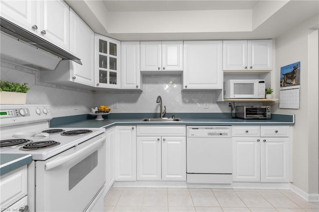3934 Whispering Oaks Pl, Virginia Beach, VA 23455 - kitchen with white appliances, a sink, extractor fan, white cabinets, and backsplash