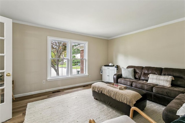 118 Cove Rd, Newport News, VA 23608 - living area with baseboards, wood finished floors, and ornamental molding