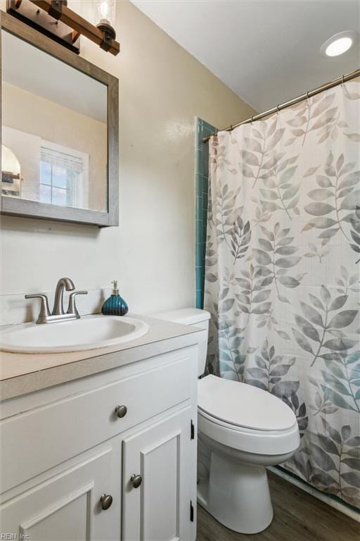 118 Cove Rd, Newport News, VA 23608 - bathroom featuring vanity, toilet, wood finished floors, and curtained shower