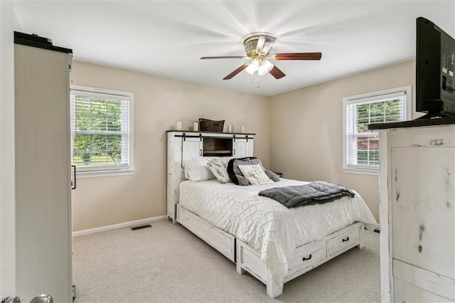 118 Cove Rd, Newport News, VA 23608 - bedroom featuring light carpet, baseboards, and a ceiling fan