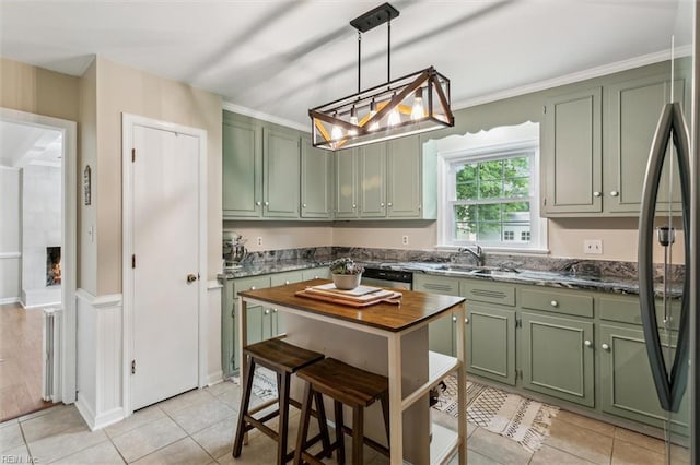 118 Cove Rd, Newport News, VA 23608 - kitchen with green cabinets, a sink, and light tile patterned floors