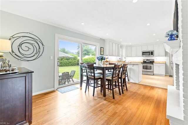 1808 Ashley Dr, Virginia Beach, VA 23454 - dining area with light wood finished floors, crown molding, recessed lighting, and baseboards