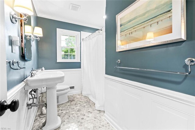 1808 Ashley Dr, Virginia Beach, VA 23454 - full bath with crown molding, toilet, a wainscoted wall, a shower with shower curtain, and a decorative wall