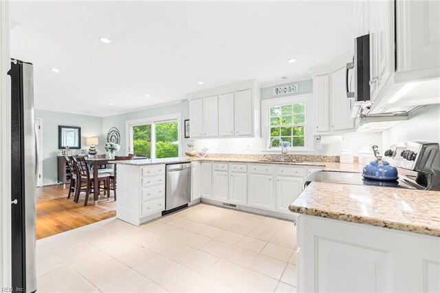 1808 Ashley Dr, Virginia Beach, VA 23454 - kitchen featuring appliances with stainless steel finishes, a sink, a peninsula, white cabinetry, and recessed lighting