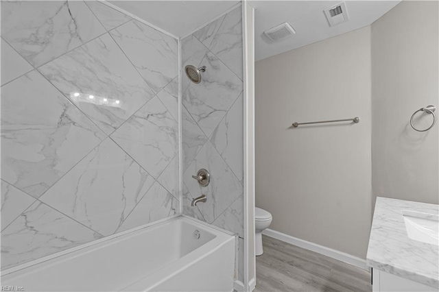 2905 Roanoke Ave, Newport News, VA 23607 - full bathroom with vanity, toilet, wood finished floors, bathing tub / shower combination, and baseboards