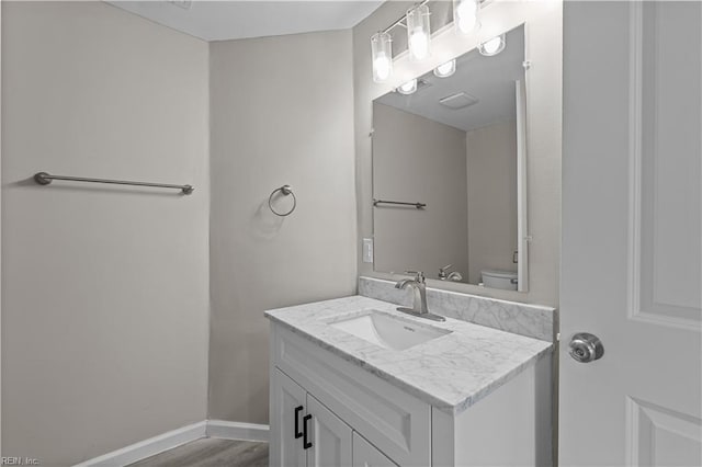 2905 Roanoke Ave, Newport News, VA 23607 - half bath featuring vanity, wood finished floors, toilet, and baseboards
