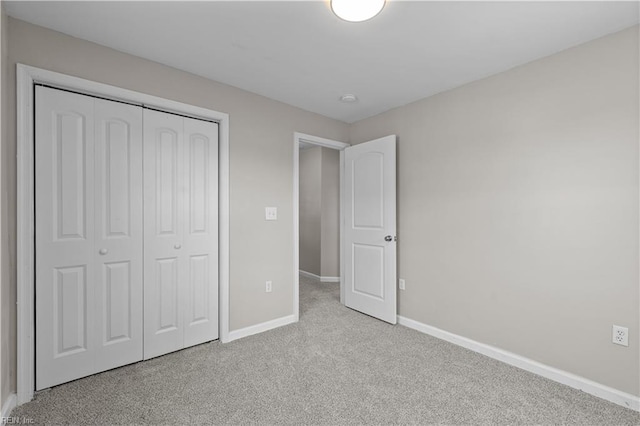 2905 Roanoke Ave, Newport News, VA 23607 - unfurnished bedroom with baseboards, a closet, and carpet flooring