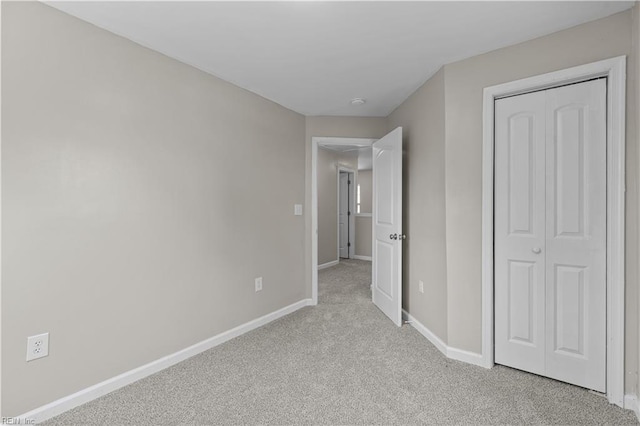 2905 Roanoke Ave, Newport News, VA 23607 - unfurnished bedroom with baseboards, light colored carpet, and a closet