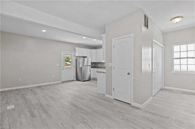 2905 Roanoke Ave, Newport News, VA 23607 - unfurnished living room with light wood finished floors, baseboards, and recessed lighting