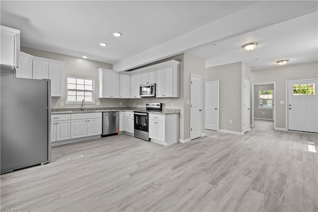 2905 Roanoke Ave, Newport News, VA 23607 - kitchen featuring stainless steel appliances, white cabinets, baseboards, and recessed lighting