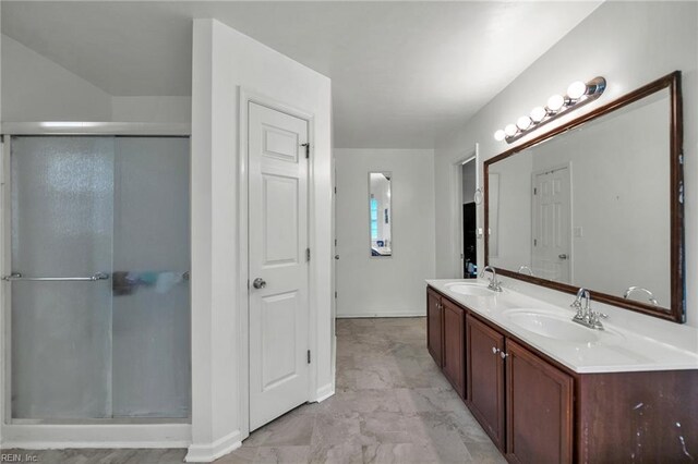 111 Windsor Ct, Suffolk, VA 23434 - bathroom featuring double vanity, a shower stall, and baseboards