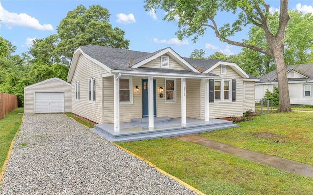 1006 Mayfield Ave, Chesapeake, VA 23324 - view of front facade with a porch, an outdoor structure, driveway, a detached garage, and a shingled roof