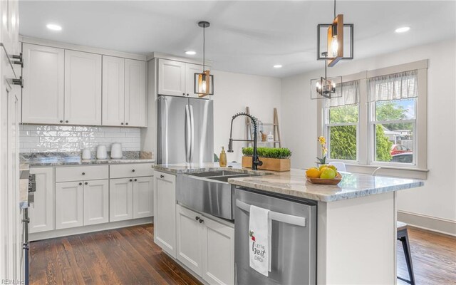 1006 Mayfield Ave, Chesapeake, VA 23324 - kitchen featuring appliances with stainless steel finishes, a sink, dark wood-style floors, decorative backsplash, and recessed lighting
