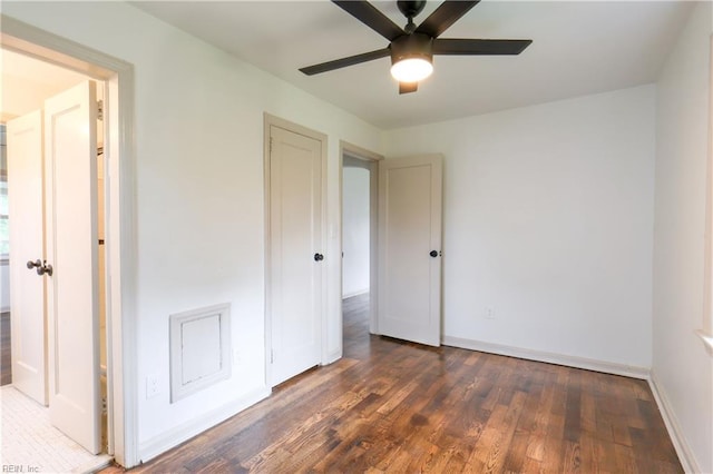 8014 E Glen Rd, Norfolk, VA 23505 - unfurnished bedroom with dark wood finished floors, baseboards, and ceiling fan