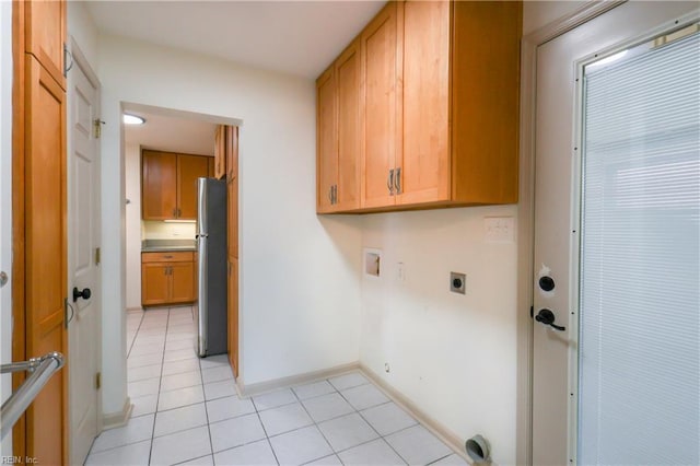 8014 E Glen Rd, Norfolk, VA 23505 - washroom with cabinet space, light tile patterned flooring, hookup for an electric dryer, hookup for a washing machine, and baseboards